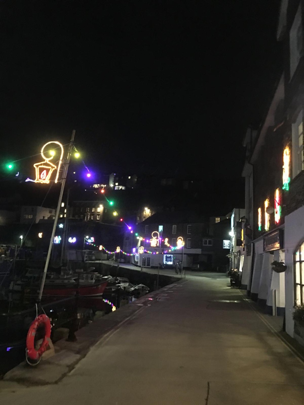 Mevagissey harbour at night under the Christmas lights