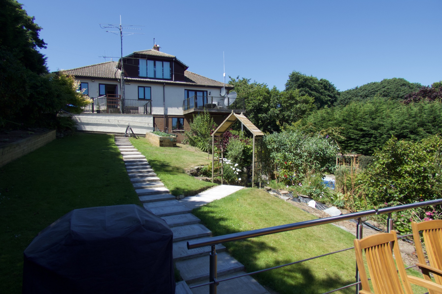 Our house seen from the bottom of the garden on a summer afternoon