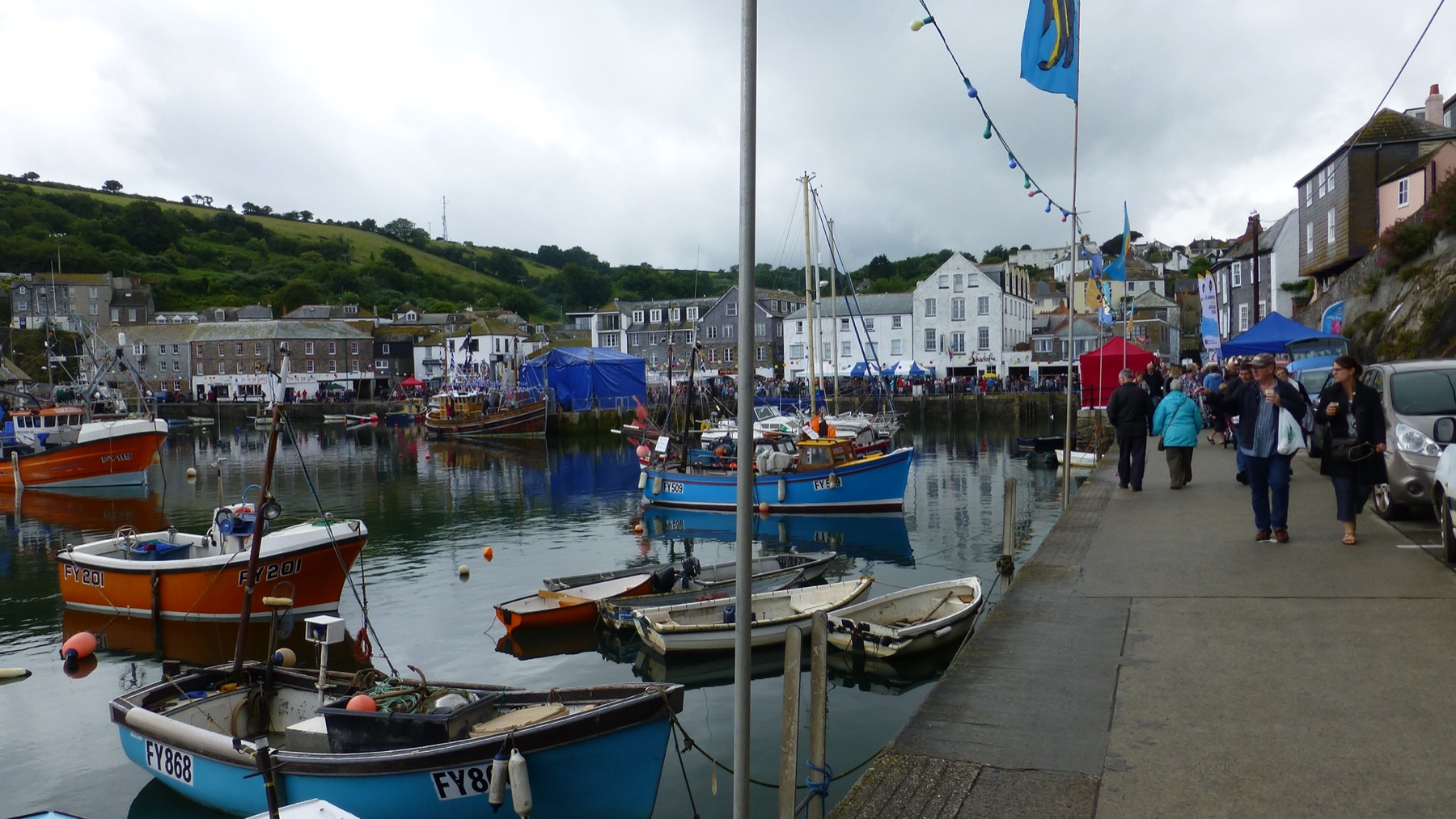 Mevagissey harbour during Feast Week, with bunting and boats